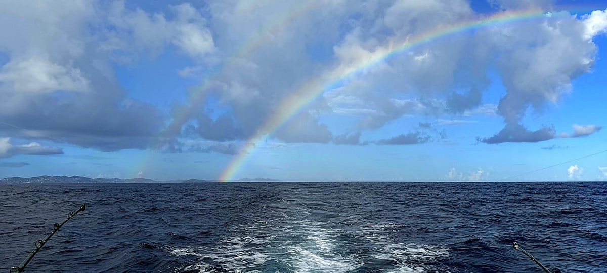 Rainbow over the wake off St. Croix with fishing rods out